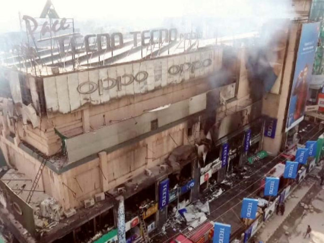 clouds of thick smoke billow from shops destroyed in a fire at pace shopping mall photo saeed anwar express clouds of thick smoke billow from shops destroyed in a fire at pace shopping mall photo saeed anwar express