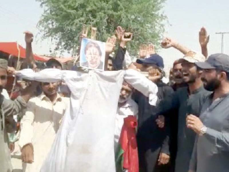 protesters carry an effigy of imran khan in dera bugti during a protest photo express