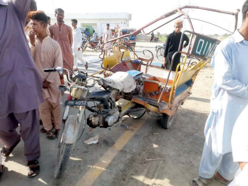 a view of what was left of the motorcycle rickshaw that was ferrying an ill fated family photo express