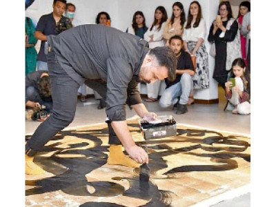 calligrapher s live performance draws visitors