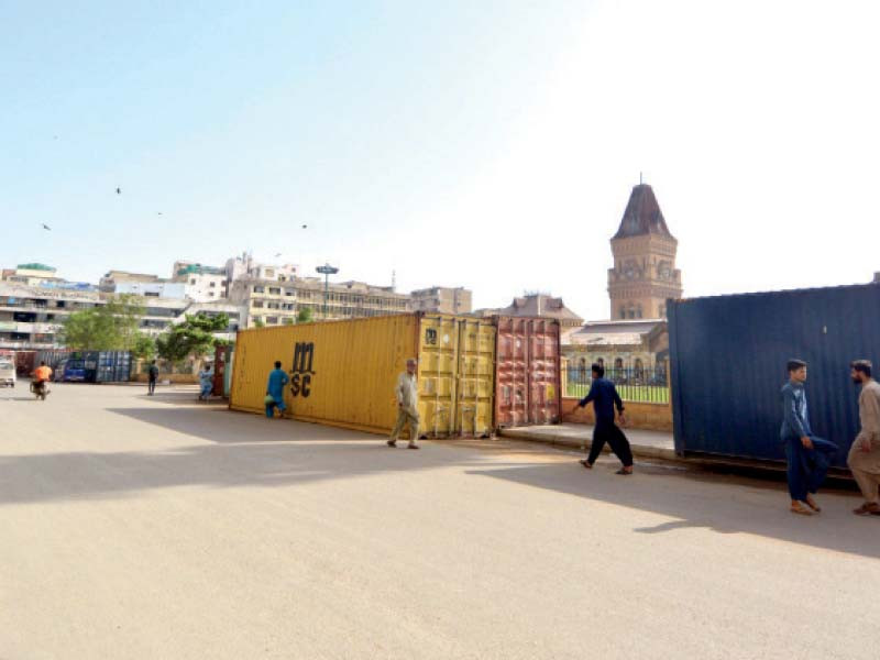 authorities have brought containers to seal the route of chehlum procession in saddar photo express