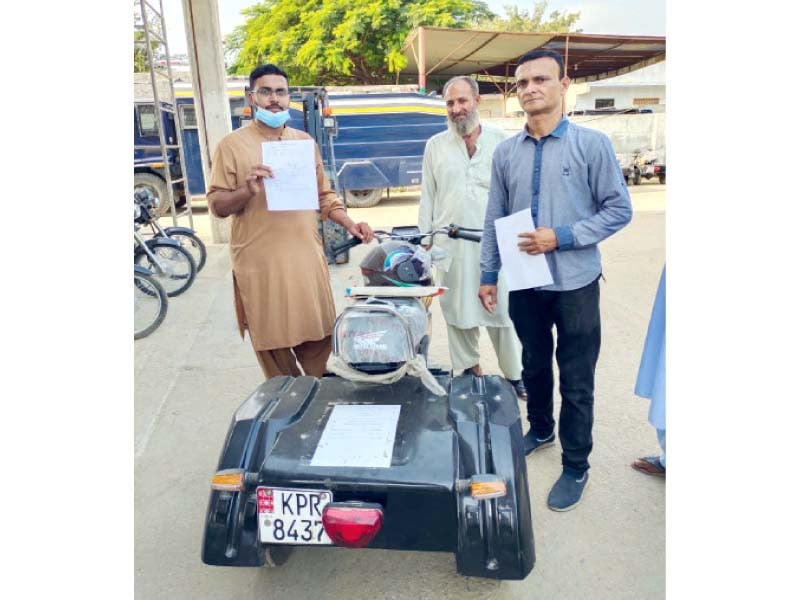 police officers hand over a three wheeler to a policeman who lost a limb during an encounter photos express