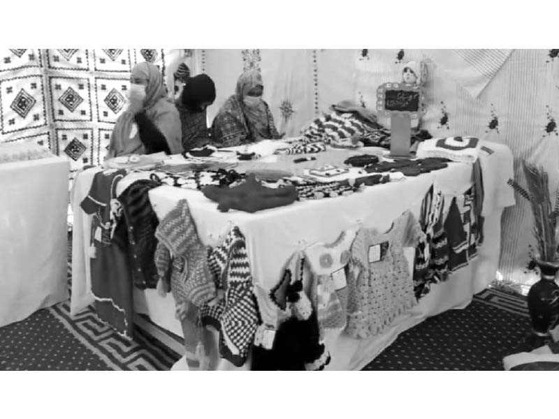 visitors take a keen interest in clothes displayed at the expo photo express