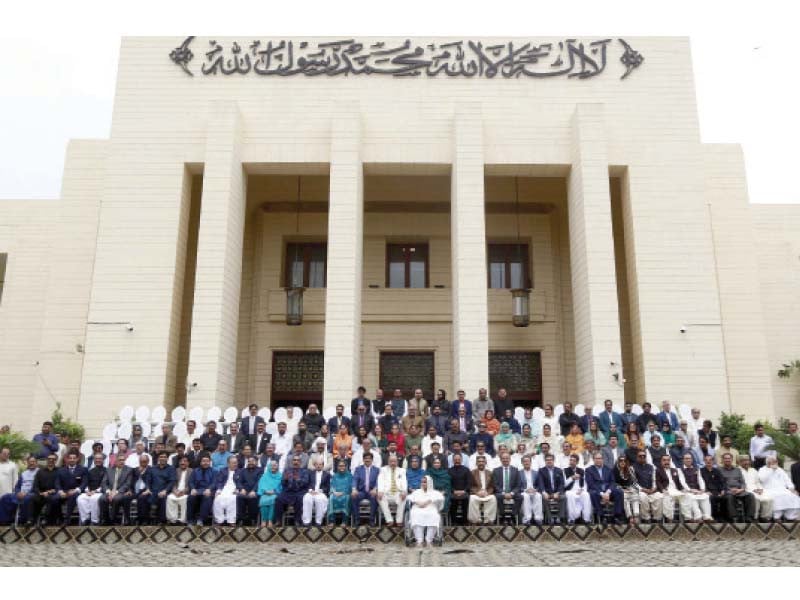 speaker agha siraj durrani and members of the sindh assembly pose for a group photo on the last day of their term photo ppi