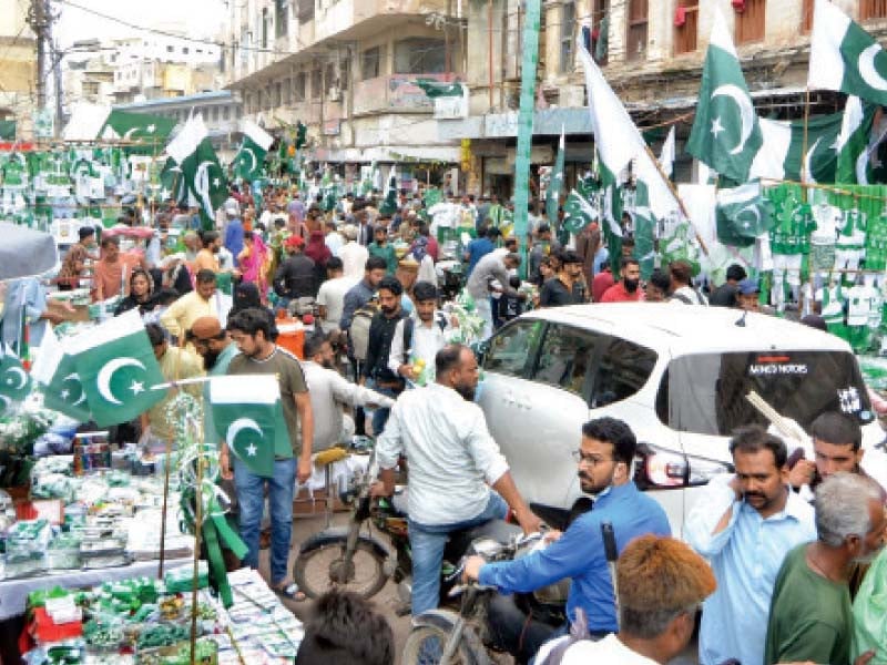 people throng the paper market to purchase flags buntings badges and other items to celebrate the independence day photo jalal qureshi express