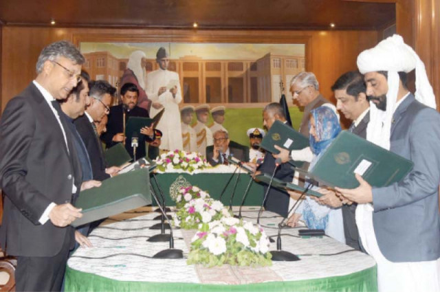 the caretaker cabinet members take oath at the cm house on saturday photo express the caretaker cabinet members take oath at the cm house on saturday photo express