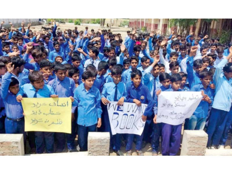 students of a government school in hyderabad protest against non availability of books photo express