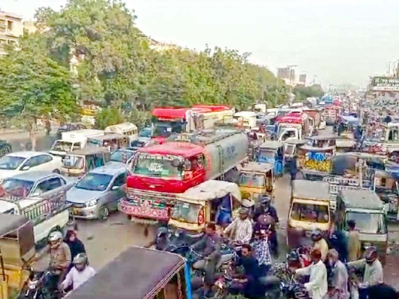 vehicles are stuck in a traffic jam in ghareebabad area due to protest against non supply of water and frequent power outages photo express
