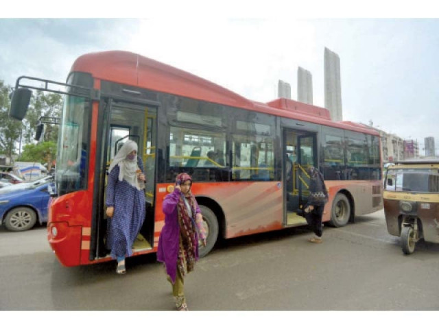 women get off a red bus on a road in the port city the public transport authority has yet to implement its ambitious plan of women bus drivers photo jalal qureshi express women get off a red bus on a road in the port city the public transport authority has yet to implement its ambitious plan of women bus drivers photo jalal qureshi express
