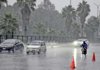motorists drive slowly on a wet road on a rainy morning in islamabad photo online file