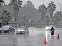 motorists drive slowly on a wet road on a rainy morning as islamabad receives a sudden downpour signalling a refreshing change in weather after the prolonged dry spell photo online