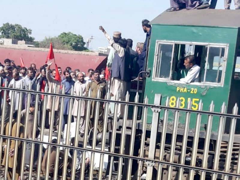 railway workers in rawalpindi take to the tracks to protest non payment of salaries photo express