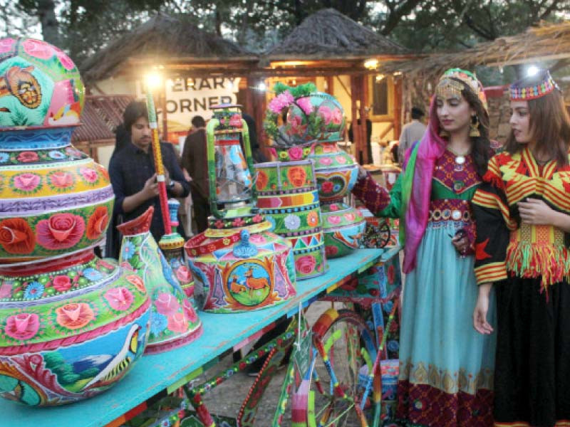 clockwise an artist from sindh displays her yarn weaving skills a dancer dances to the beats of traditional music of gilgit baltistan a stall showcases handcrafted items and a painter gives final touches to a beautiful painting photos zafar raja express