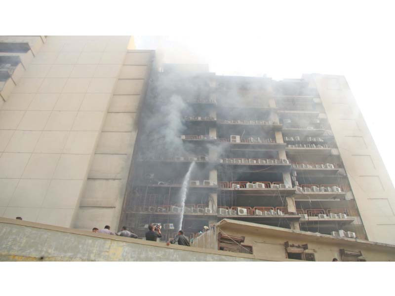 firemen douse blaze that erupted at the business and finance centre on ii chundigar road on monday photo online