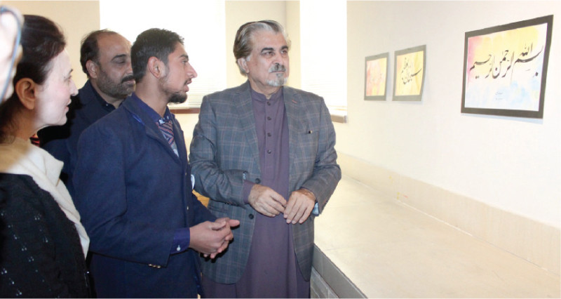 caretaker federal minister for national heritage and culture jamal shah takes keen interest in the calligraphic work of seminary students photo express