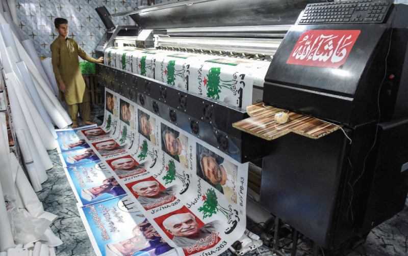 election posters are being printed at a shop in quetta photo afp