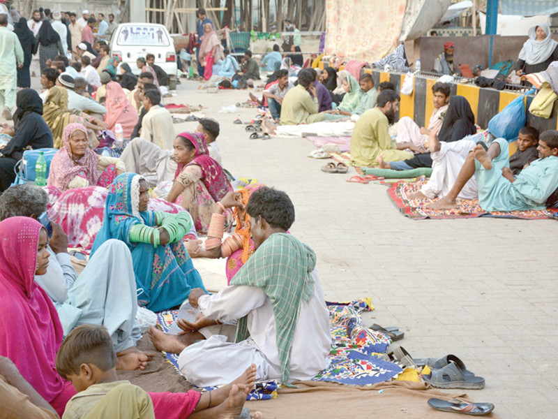 people who come from far flung areas with the patients sit along a passage in the national institute of child health photo express