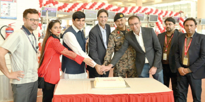 fly jinnah ceo arman yahya director ali muscatia asf chief security officer colonel nadeem asif and airport manager aftab geelani cutting the cake at the opening ceremony of fly jinnah s flight to muscat photo file