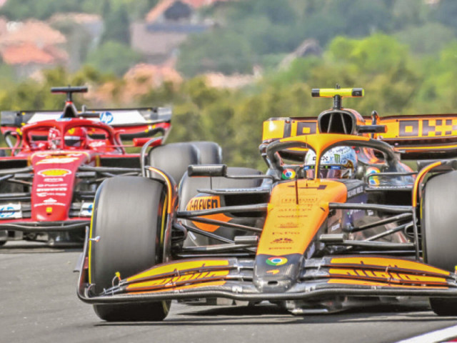 mclaren s british driver lando norris r at the hungaroring race track in mogyorod near budapest photo afp mclaren s british driver lando norris r at the hungaroring race track in mogyorod near budapest photo afp