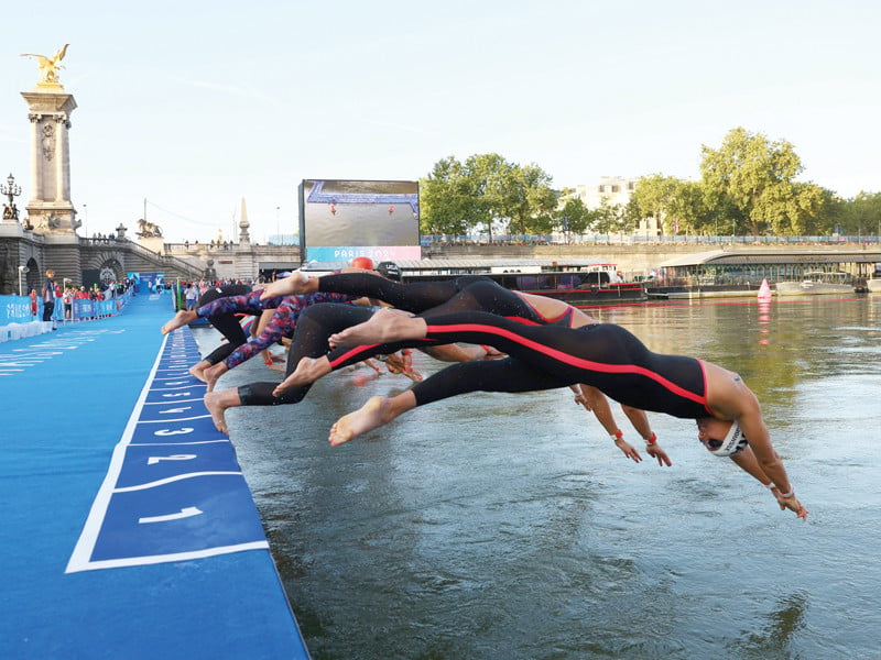 athletes dive into the seine river during the 10km marathon swimming event at paris 2024 photo reuters