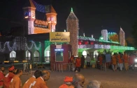porters wait for passengers outside the lahore railway station colourfully illuminated on the eve of the independence day photo express mehmood qureshi