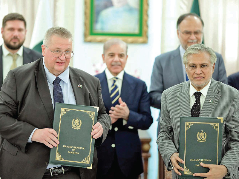 deputy prime minister ishaq dar and his russian counterpart alexey overchuk pose for a picture during an mou signing ceremony in the federal capital aimed at increasing cooperation in various fields photo nni