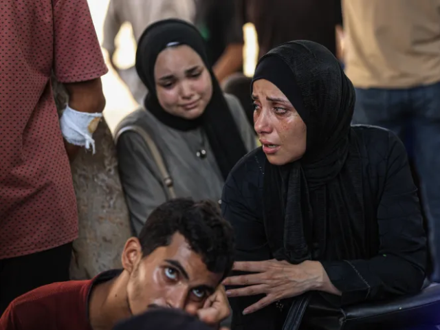 Relatives and loved ones of Palestinians who lost their lives after Israeli forces opened fire on a crowd arrived at an aid distribution point to mourn, at al-Shifa Hospital in Gaza City [Anadolu]