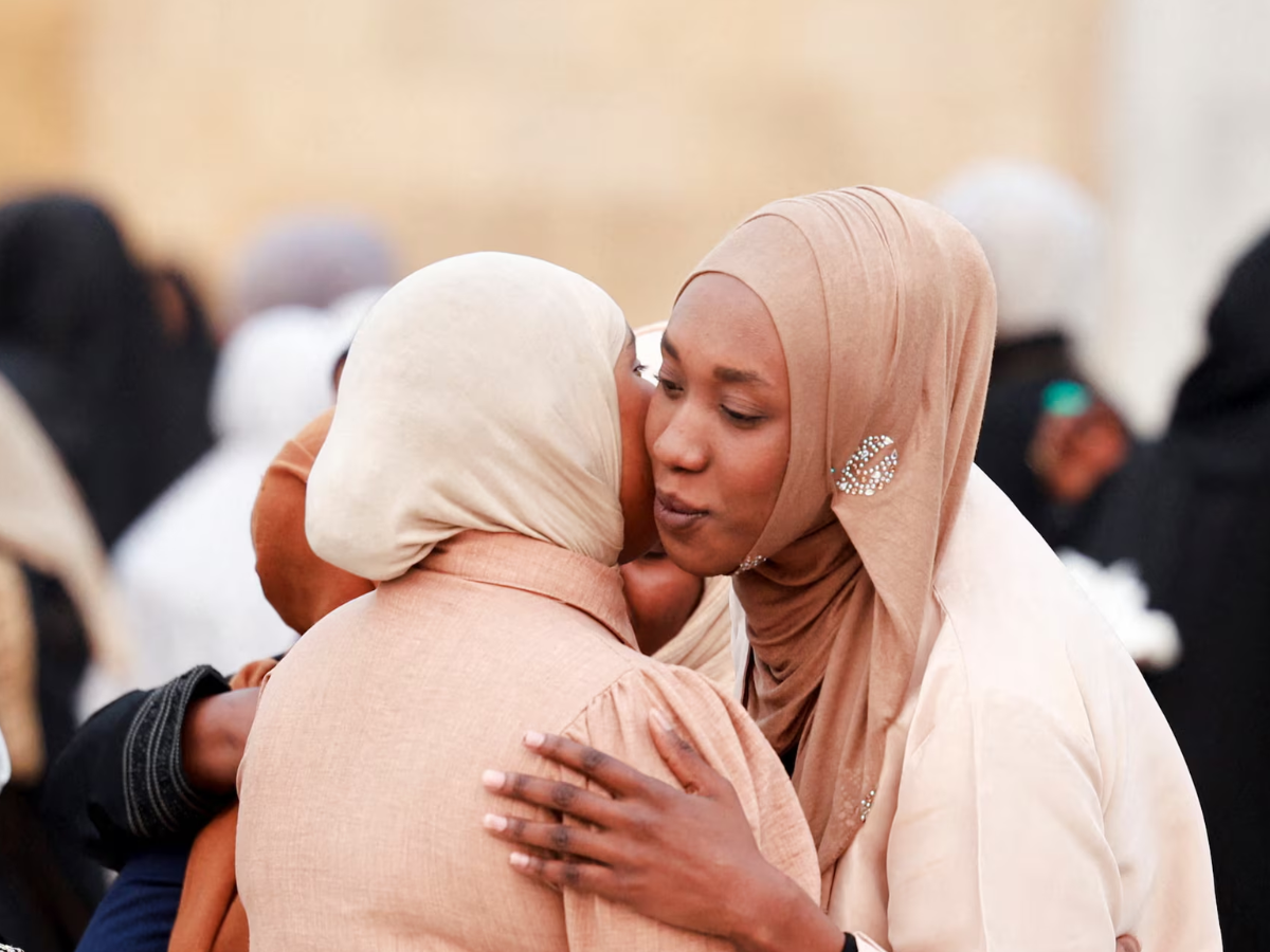 Sunni Muslim worshippers exchange greetings after Eid al-Fitr prayers at the shrine of cleric Sheikh Abdul Qadir al-Gailani in Baghdad, Iraq, March 20, 2026. REUTERS/