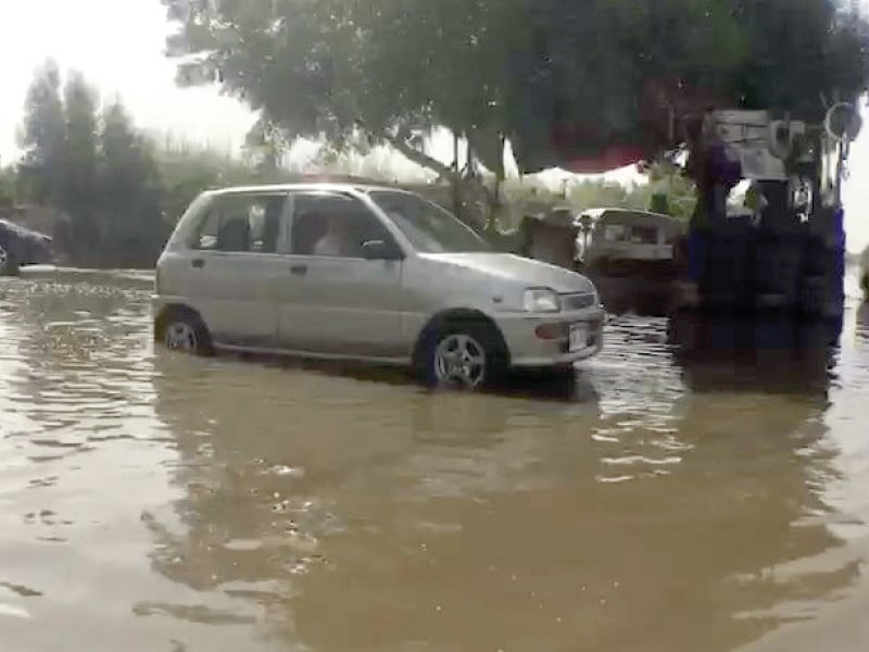 sewage has flooded the roads of scheme 33 for the past three days adding to the plight of citizens photo express