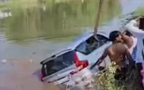 woman child killed as car plunges into canal