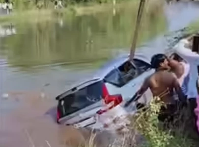 woman child killed as car plunges into canal