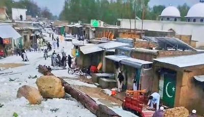 a street in the central bazaar of the feroz khel area in khyber pakhtunkhwa s orakzai district is covered in a thick layer of hail after a severe storm photo nni