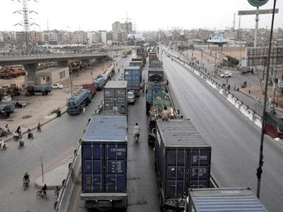 land grabbers protest when residents of akhtar colony try to stop them