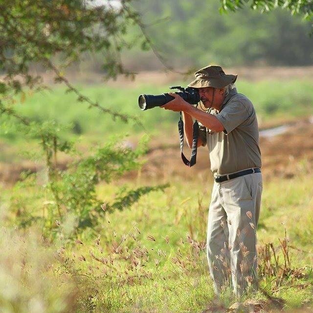 mirza beg in action as he photographs birds in the rural area of sindh photo courtesy   fahad siddiqui