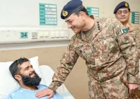 coas general syed asim munir enquires after the well being of a soldier at the combined military hospital in rawalpindi photo app