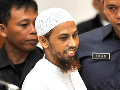 still smiling suspected bali bomber stands trial still smiling suspected bali bomber stands trial
