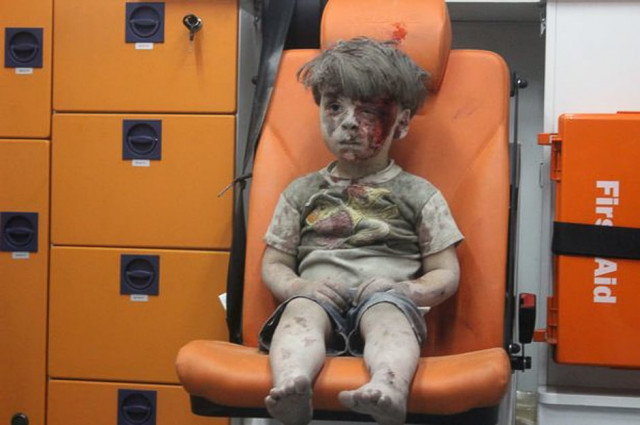 a picture of 5 year old omran daqneesh with bloodied face sits inside an ambulance after he was rescued following an airstrike in the rebel held al qaterji neighbourhood of aleppo photo reuters
