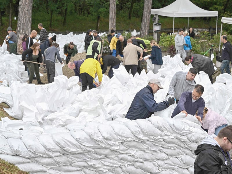 local residents use sandbags for flood protection in the village of szigetmonostor hungary photo afp