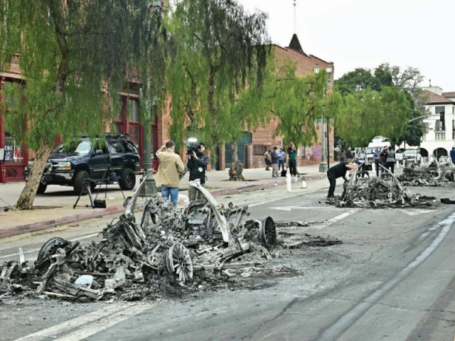 the remains of multiple burned waymo vehicles are seen in the street following a night of protests in response to federal immigration operations in los angeles photo afp the remains of multiple burned waymo vehicles are seen in the street following a night of protests in response to federal immigration operations in los angeles photo afp
