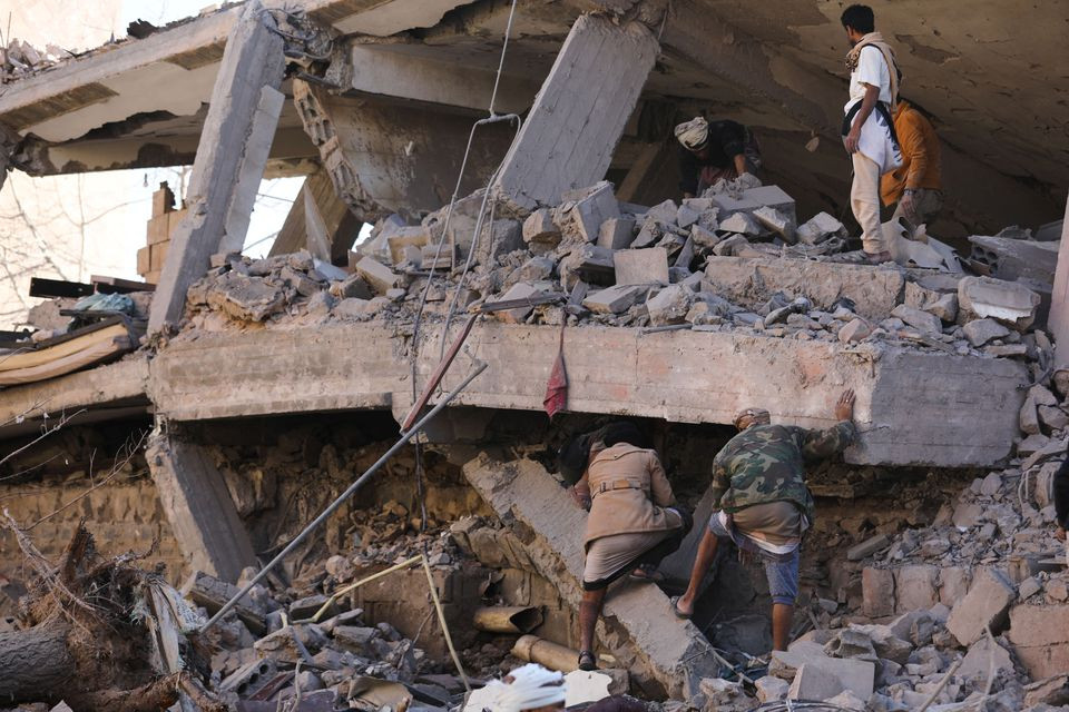 rescuers search for survivors under the collapsed roof of a house hit by saudi led air strikes in sanaa yemen january 18 2022 photo reuters