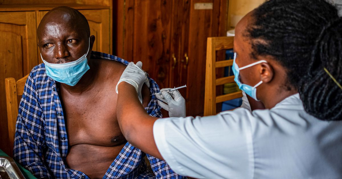 a man receives a vaccine against the coronavirus disease covid 19 at the masaka hospital in kigali rwanda march 5 2021 photo reuters