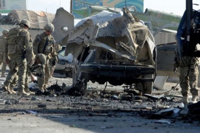 taliban bomber kills 9 at nato base to avenge quran burning