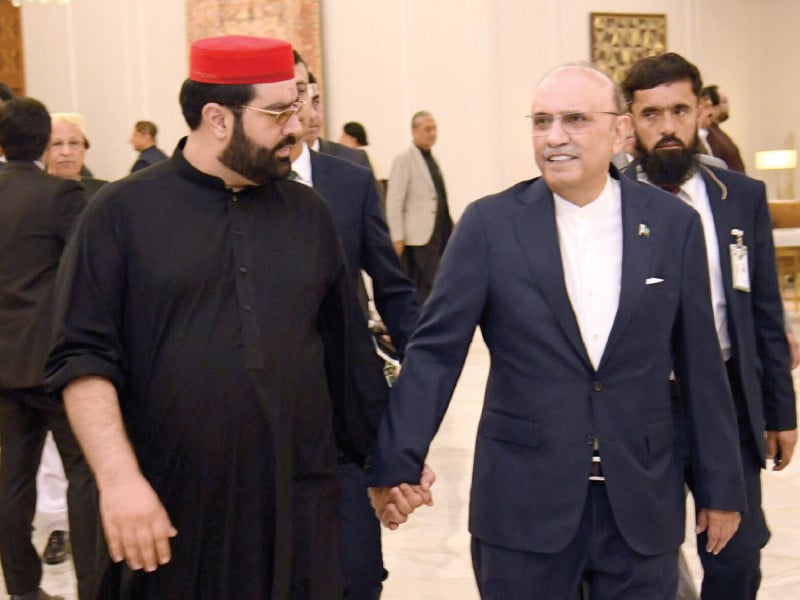 president asif zardari walks with anp leader aimal wali khan at a dinner reception at aiwan e sadr photo express