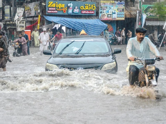 soaked to the skin and undeterred commuters brave flooded streets as heavy monsoon rains drench hyderabad turning roads into rivers photo afp soaked to the skin and undeterred commuters brave flooded streets as heavy monsoon rains drench hyderabad turning roads into rivers photo afp