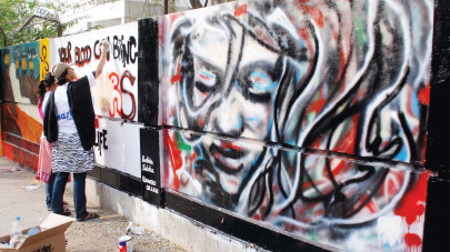 street art competition students paint gulberg town red green orange