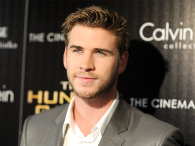 miley and i aren t official liam hemsworth