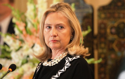 clinton s likely april visit hinges on review