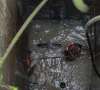 child swept away in drain