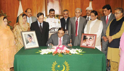 president zardari signs two bills into law