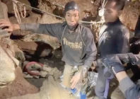 rescuers pull out the first trapped person named mued from a flooded cave in xaisomboun province laos photo reuters